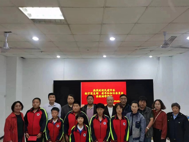 民建市委抚宁区支部和老年妇女委员会联合开展捐资助学活动1 (2)-1.jpg